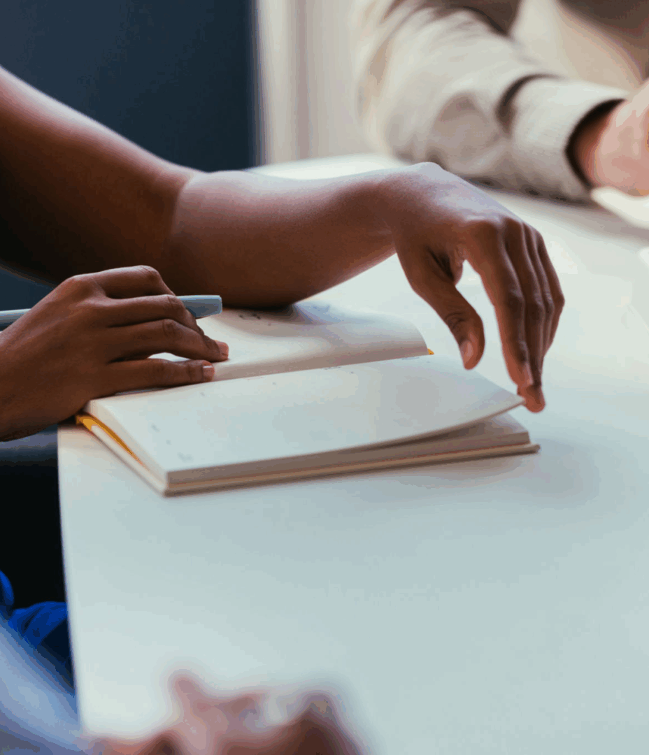Person reading at a table