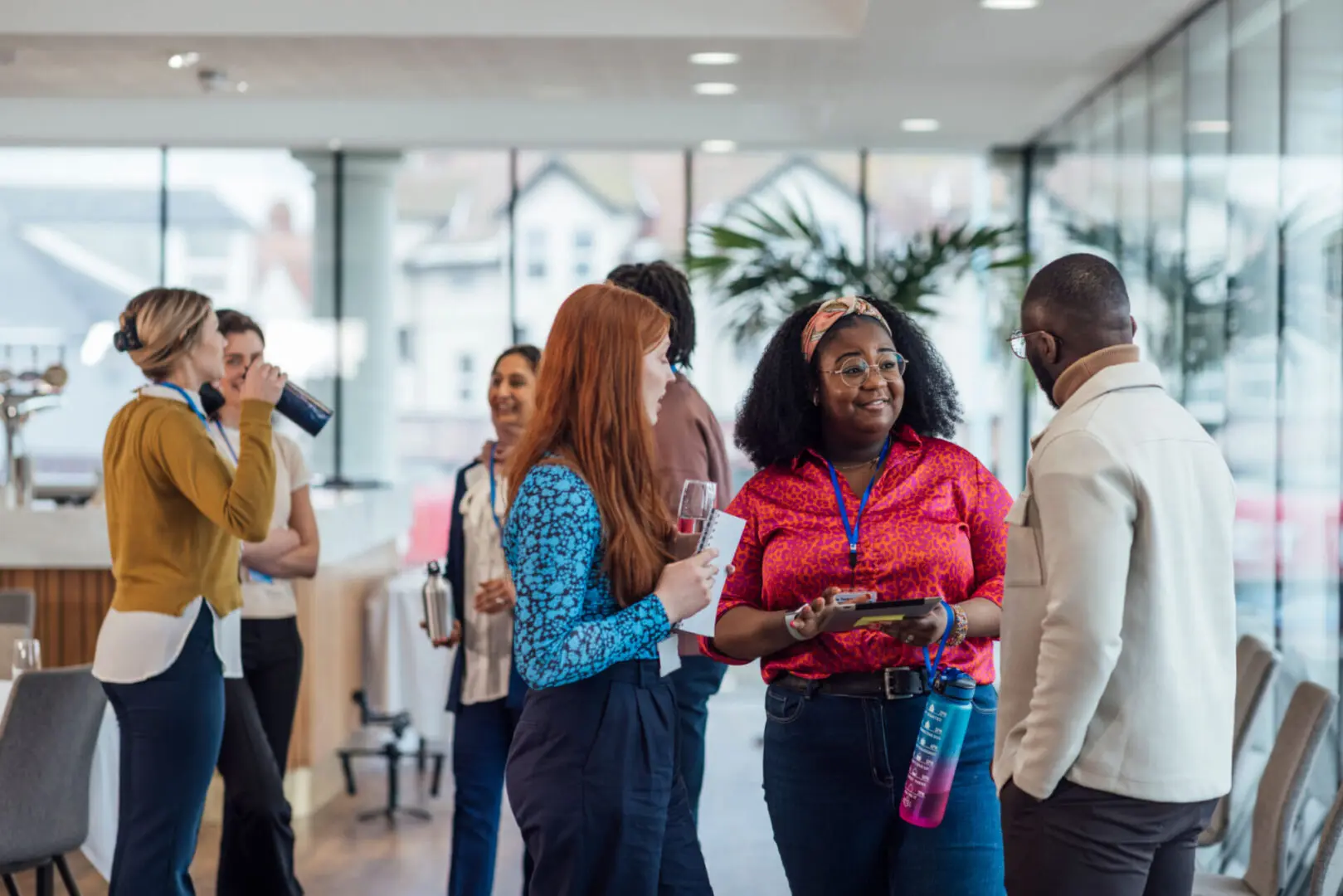 Professionals socializing in a modern office space